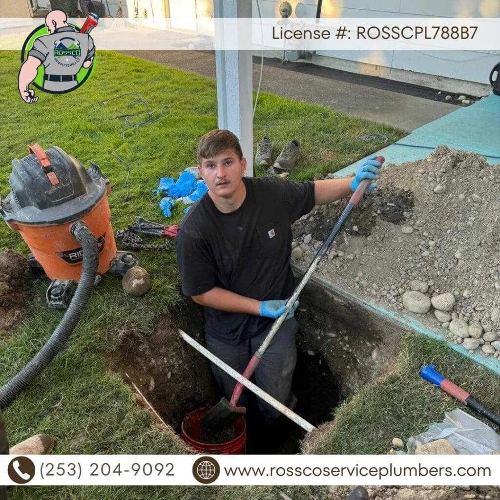 Person digging a trench outdoors.